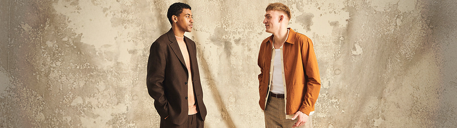 A man standing on a mountain wearing No Nationality NN07 clothing shirt