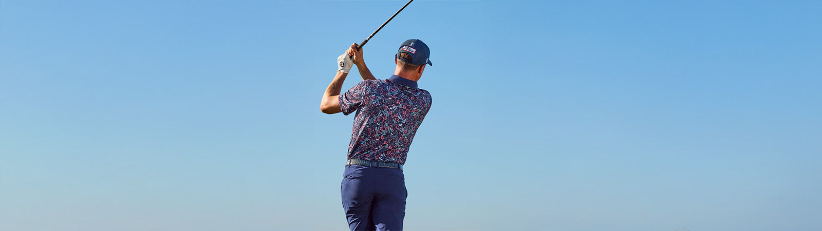 golfer wearing an outfit from greyson clothiers