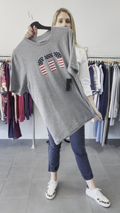 Mary showing the star bright t-shirt from Travis Mathew