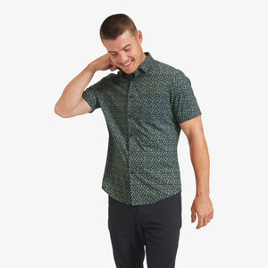 man wearing navy green leaf print shirt